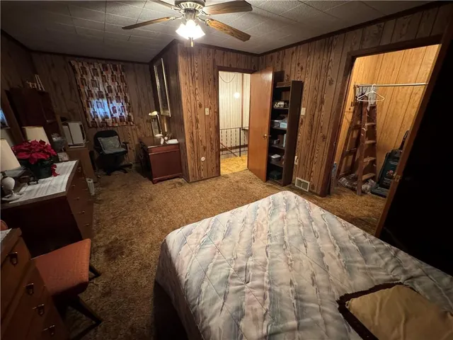 a bed room with a bed and a mirror