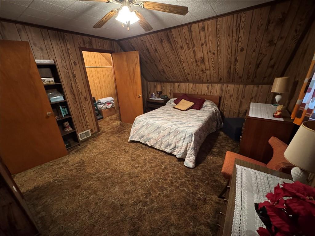 31 Orr Road West Newton, PA 15089 - Photo 7 of 48 a bed sitting in a bedroom next to a window