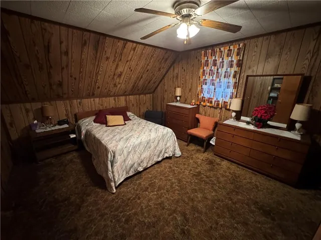 a bedroom with furniture and a chandelier