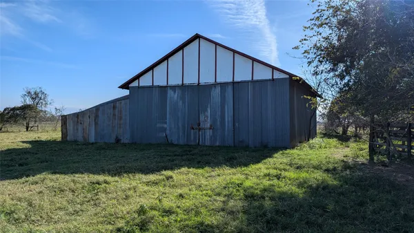 a view of a field with trees