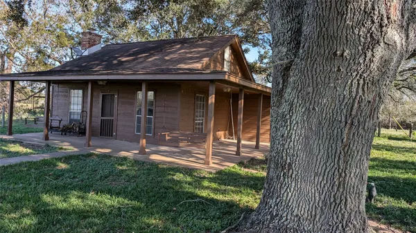 a view of a house with a small garden
