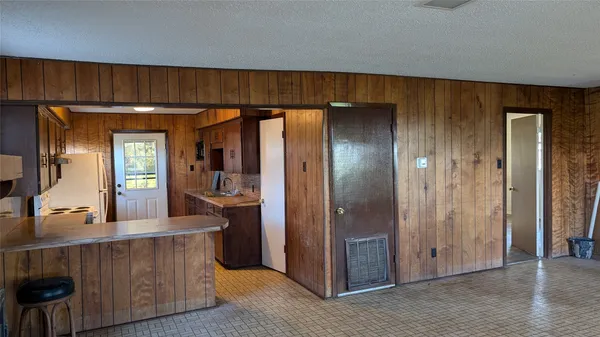 a kitchen with stainless steel appliances a refrigerator and cabinets