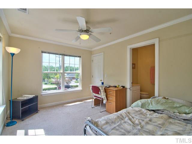 929 Morreene Road, Unit A24 Durham, NC 27705 - Photo 11 of 13 a bedroom with a bed and a window