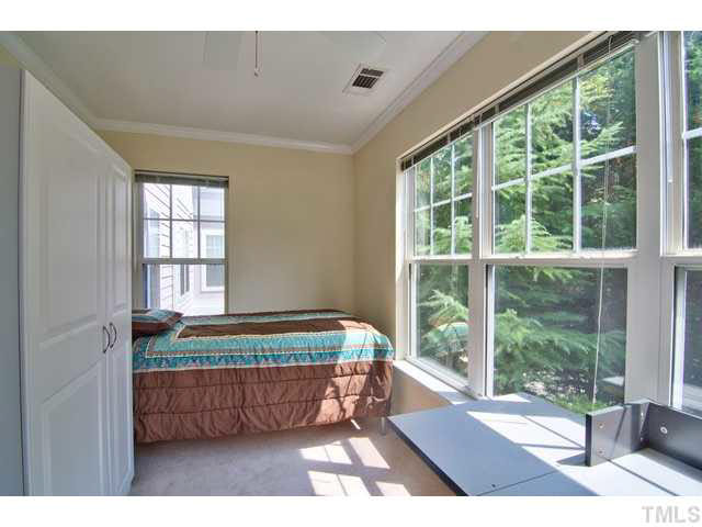 929 Morreene Road, Unit A24 Durham, NC 27705 - Photo 12 of 13 a bedroom with furniture and large window