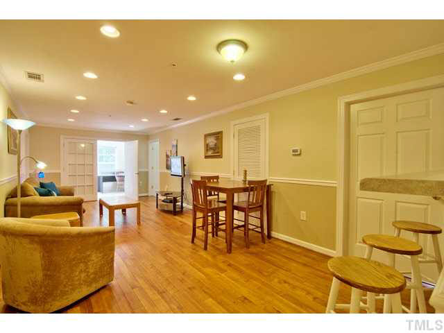 929 Morreene Road, Unit A24 Durham, NC 27705 - Photo 5 of 13 a living room with lots of furniture and a wooden floor