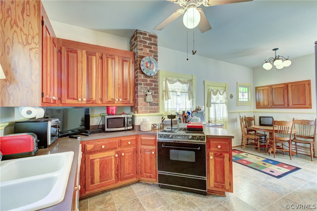 3048 River Road West Goochland, VA 23063 - Photo 14 of 49 a kitchen with granite countertop a sink stove and cabinets