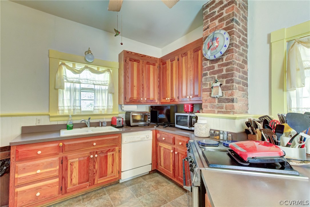 3048 River Road West Goochland, VA 23063 - Photo 15 of 49 a kitchen with a stove a sink and a microwave