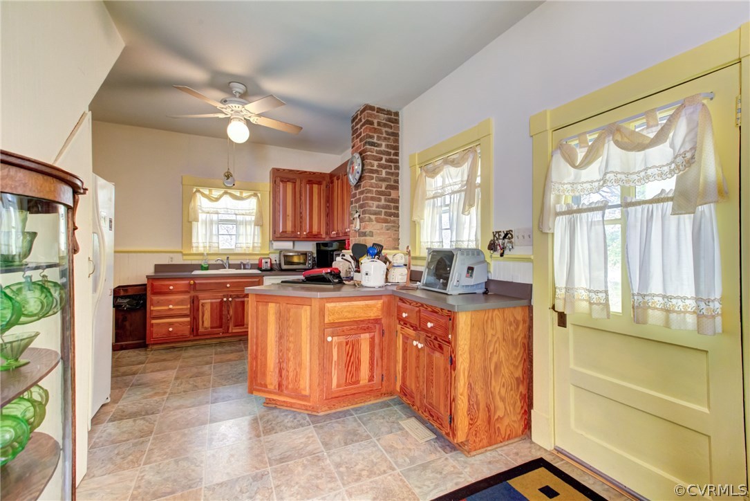 3048 River Road West Goochland, VA 23063 - Photo 17 of 49 a large kitchen with kitchen island a large counter top space a sink stainless steel appliances and cabinets