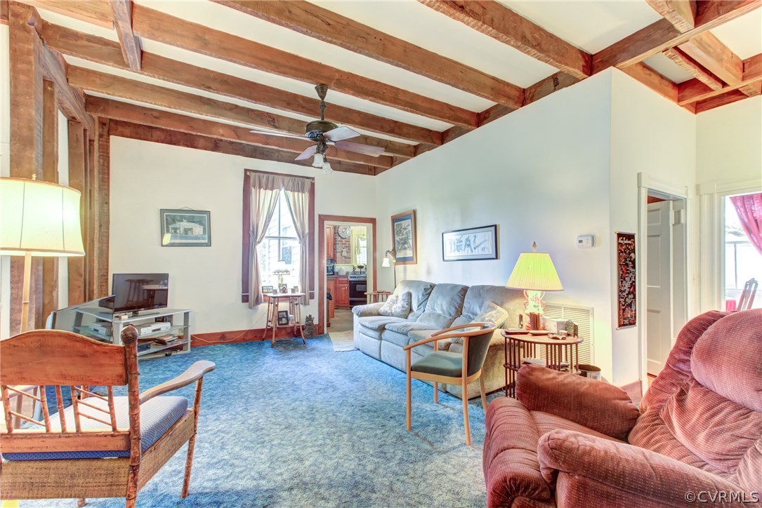 3048 River Road West Goochland, VA 23063 - Photo 22 of 49 a living room with furniture a chandelier and a window
