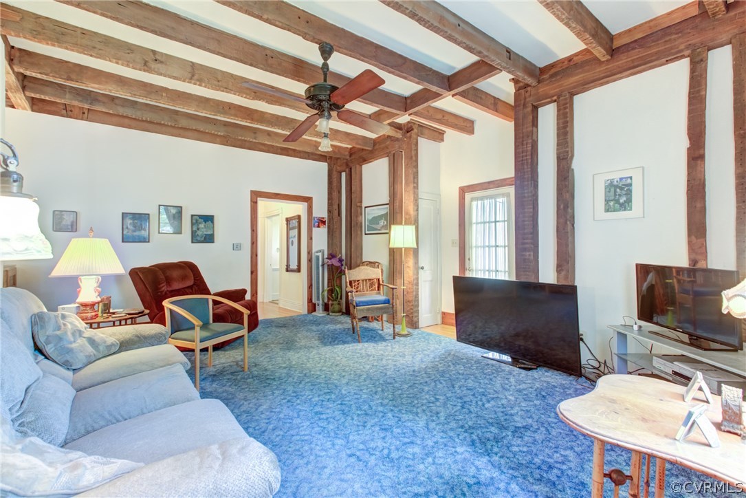 3048 River Road West Goochland, VA 23063 - Photo 23 of 49 a living room with furniture a flat screen tv and a window