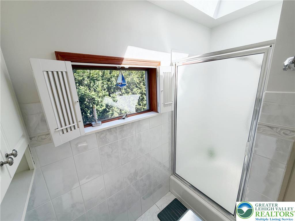 2741 Limestone Street Coplay, PA 18037 - Photo 16 of 35 a bathroom with a window and a shower