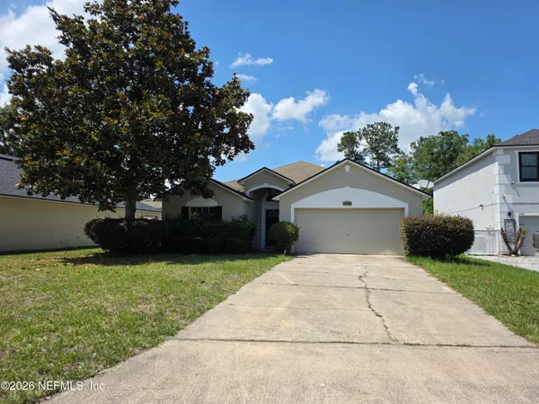 a front view of a house with yard