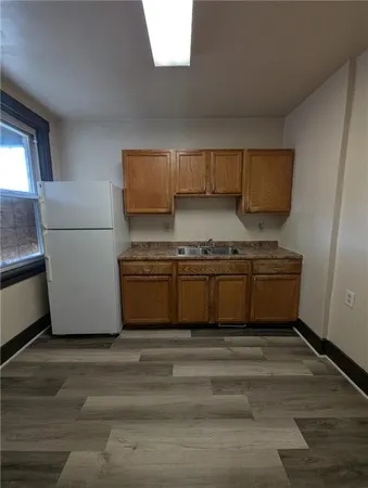 a kitchen with a stove and a refrigerator