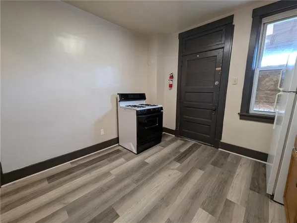a view of an empty room and fire place