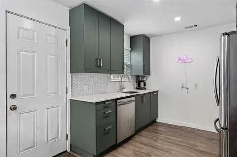 a kitchen with a refrigerator stove and microwave