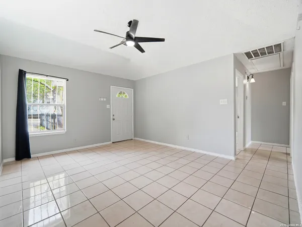 a view of an empty room and window