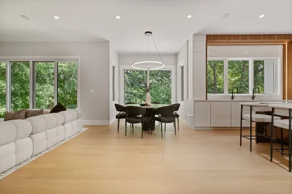 a view of a dining room with furniture window and outside view