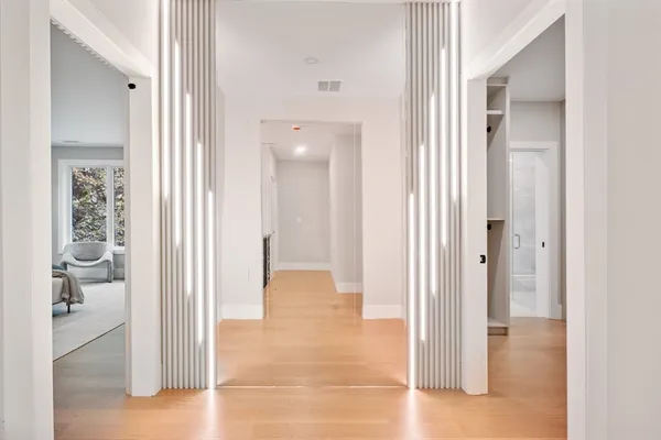 a view of a bathroom from a hallway