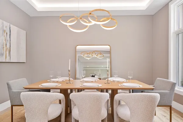 a dining room with furniture and window