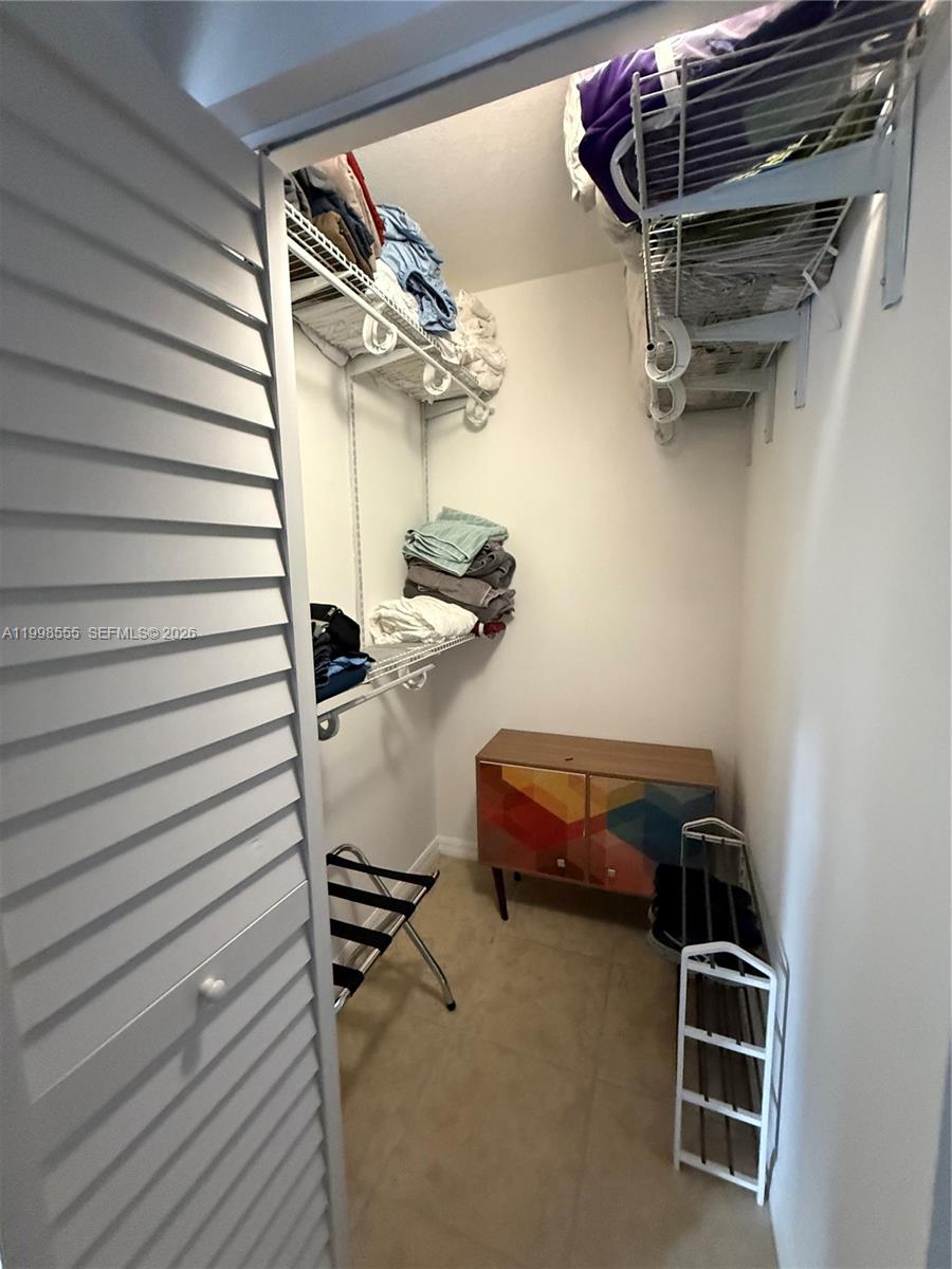 119 Southwest 6th Avenue, Unit 405 Miami, FL 33130 - Photo 15 of 23 a room with gym equipment