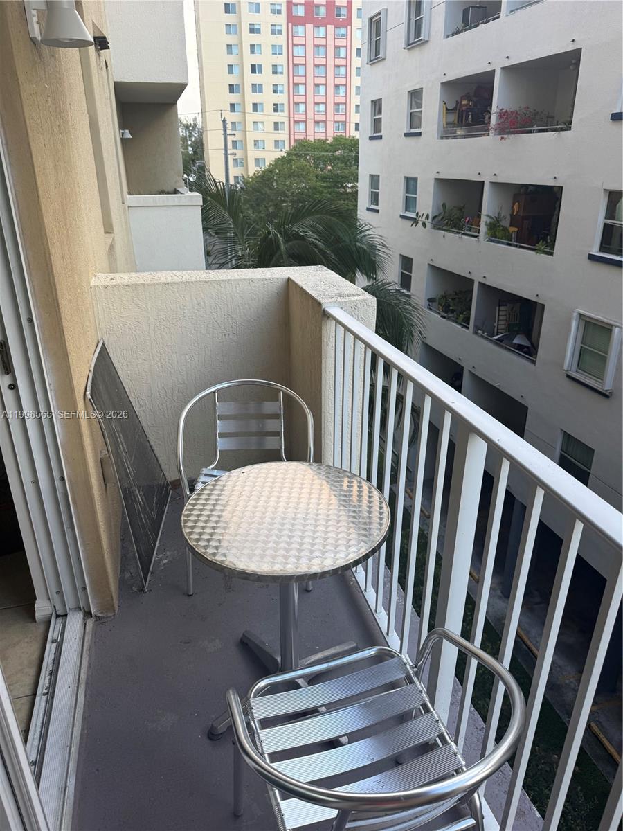 119 Southwest 6th Avenue, Unit 405 Miami, FL 33130 - Photo 16 of 23 a view of balcony with furniture