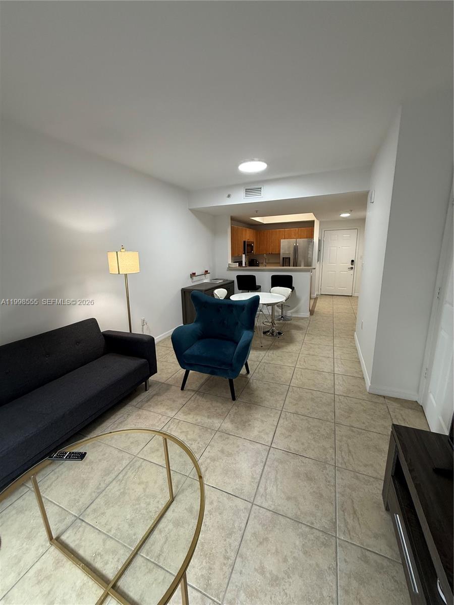119 Southwest 6th Avenue, Unit 405 Miami, FL 33130 - Photo 7 of 23 a living room with furniture and a couch