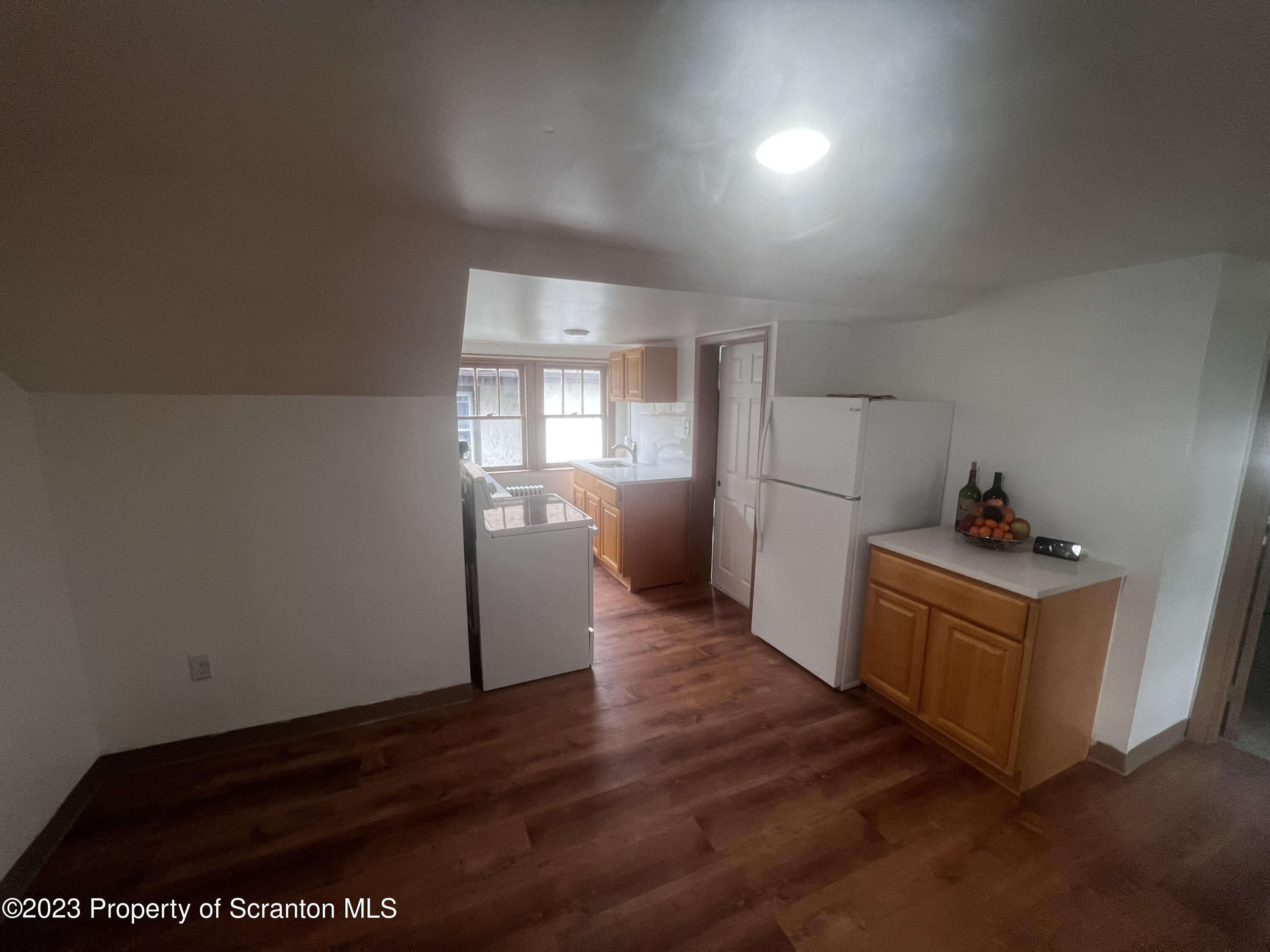 534 Fig Street, Unit 3 Scranton, PA 18505 - Photo 5 of 8 a kitchen with a refrigerator and a stove top oven