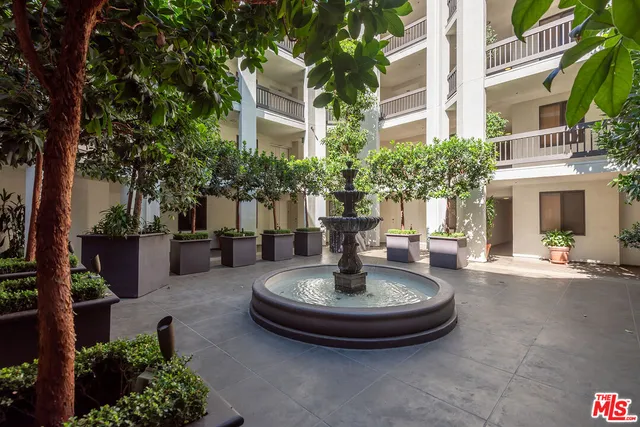 a view of a house with fountain and a fountain