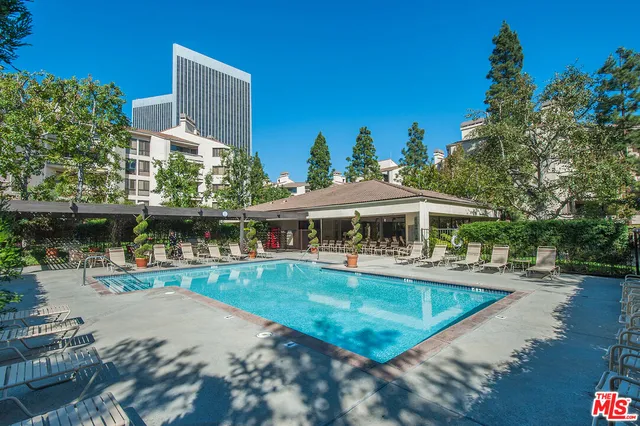 a view of a swimming pool with a patio