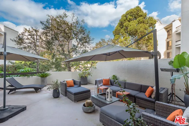 a outdoor living space with furniture and city view