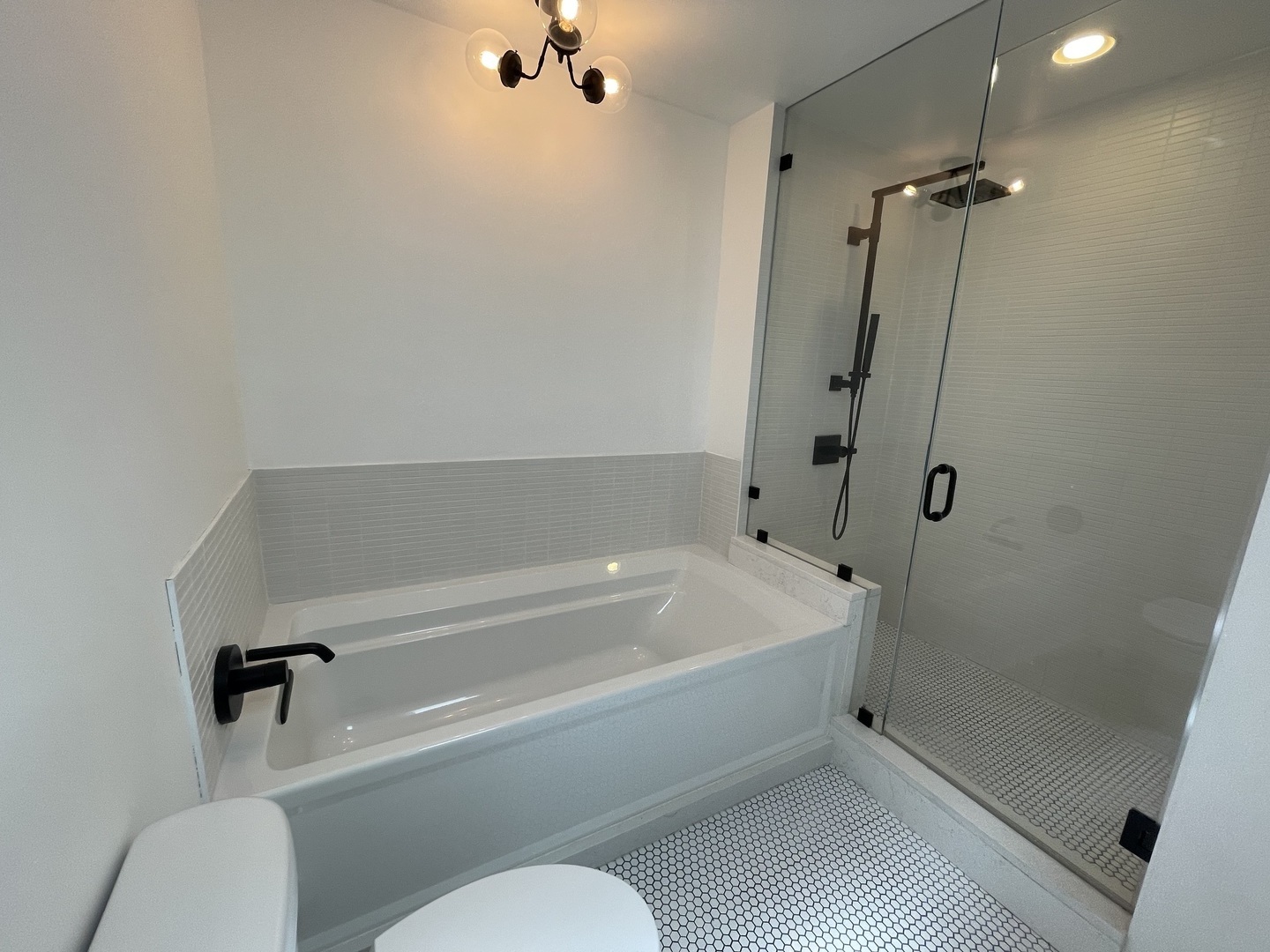 14 North Sangamon Street, Unit 403 Chicago, IL 60607 - Photo 13 of 18 a bathroom with a toilet and a shower