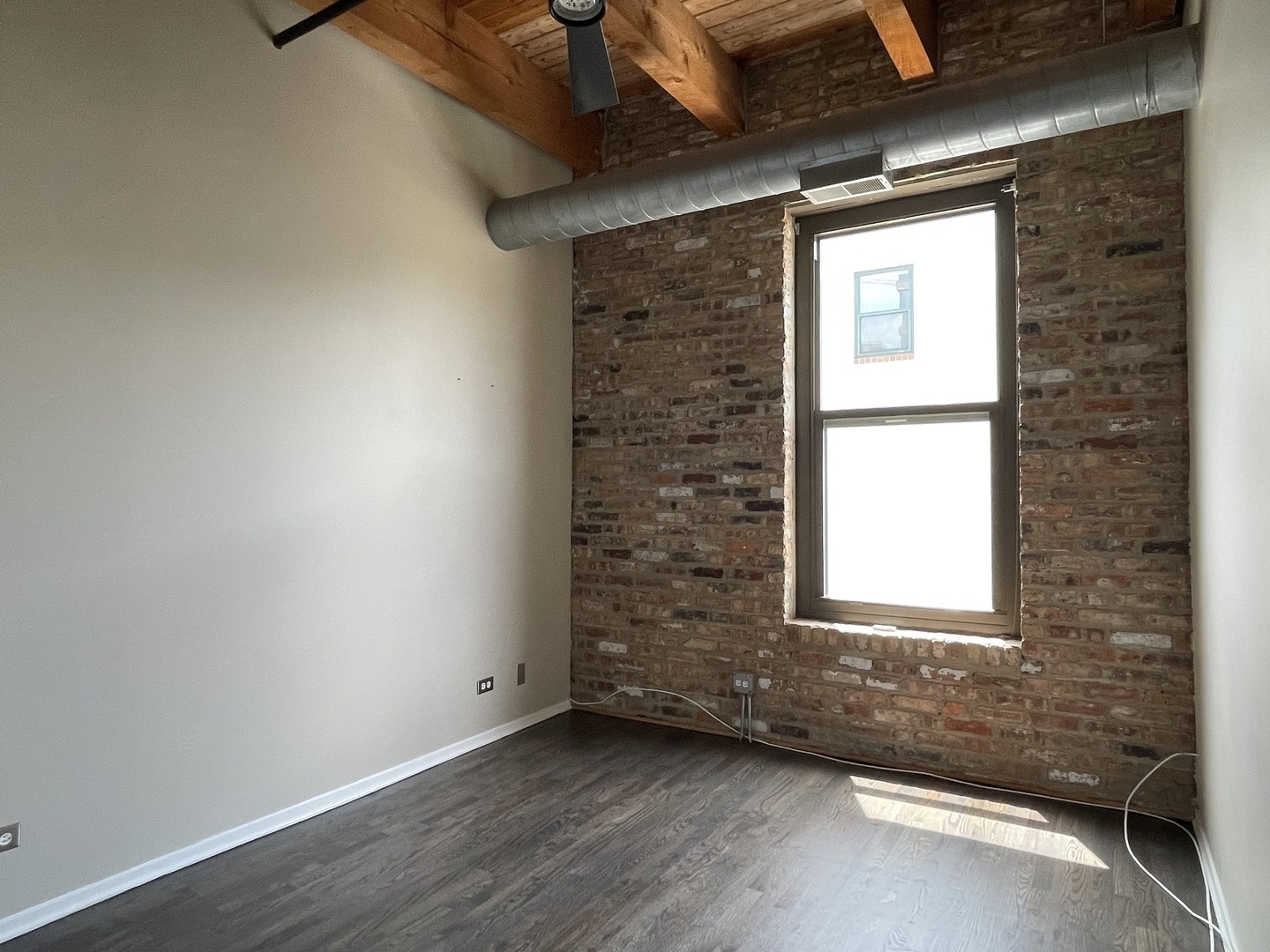 14 North Sangamon Street, Unit 403 Chicago, IL 60607 - Photo 15 of 18 a view of an empty room and a window