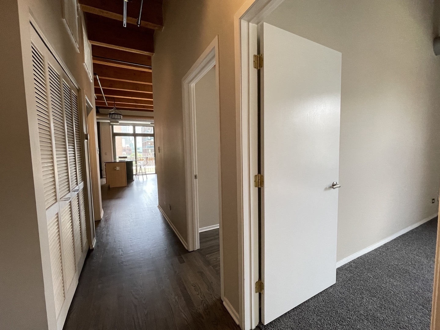 14 North Sangamon Street, Unit 403 Chicago, IL 60607 - Photo 9 of 18 a view of a hallway with wooden floor
