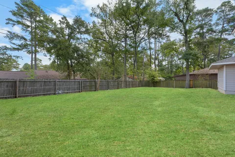 a view of a house with backyard