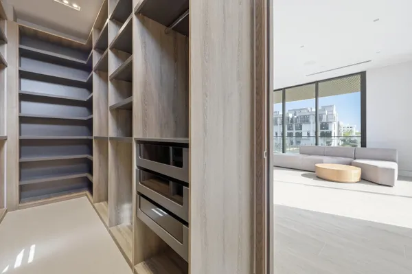 a kitchen with a refrigerator and washing machine