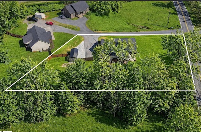 745 Dave Nix Road Seneca, SC 29678 - Photo 3 of 23 An aerial perspective showcases a residential plot bordered by lush trees and a paved road.