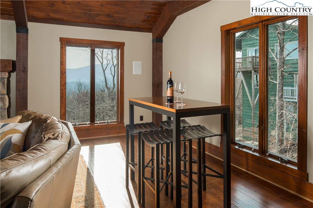 260 Beacon Hill Blowing Rock, NC 28605 - Photo 11 of 47 a view of balcony with furniture and wooden floor