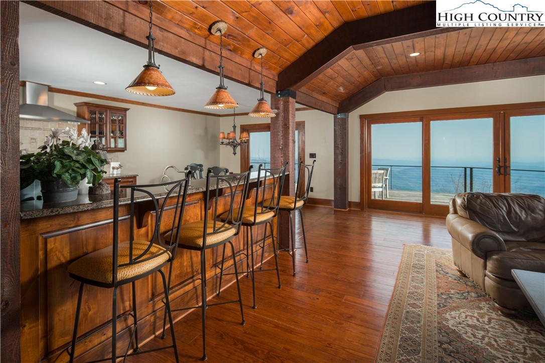 260 Beacon Hill Blowing Rock, NC 28605 - Photo 12 of 47 a dining room with furniture window and wooden floor