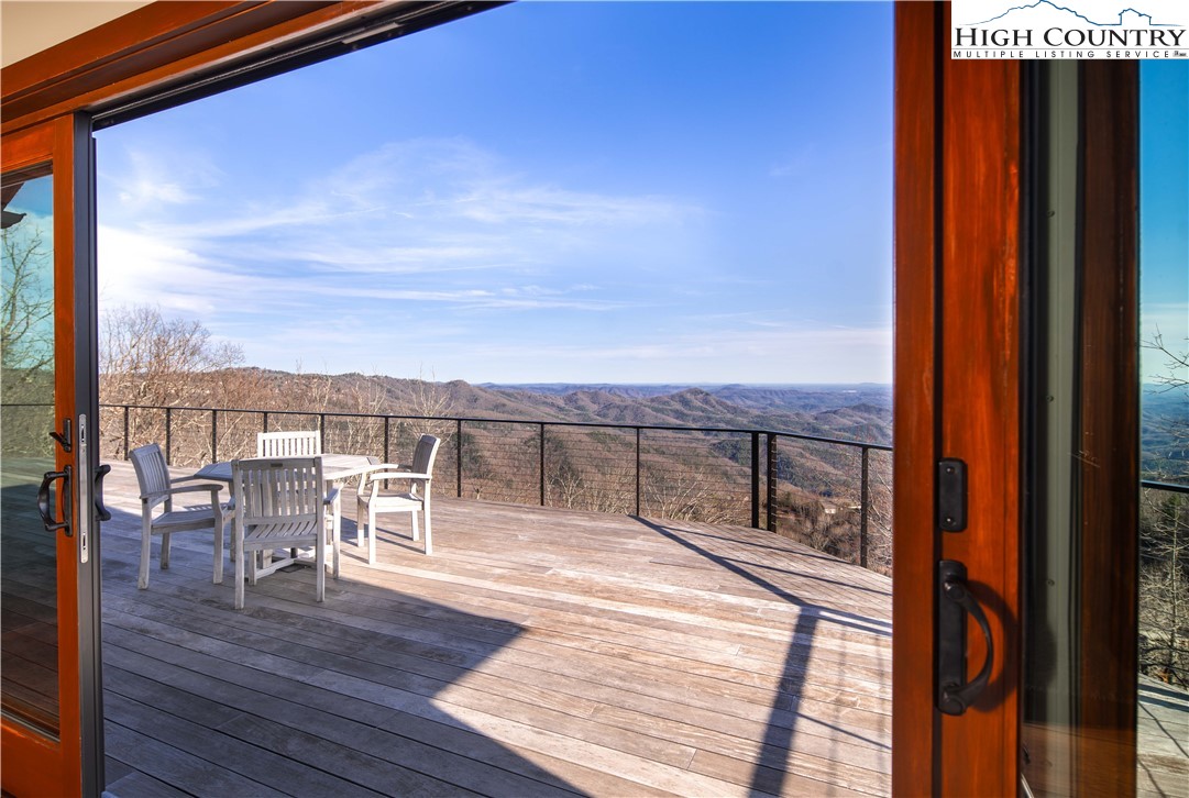 260 Beacon Hill Blowing Rock, NC 28605 - Photo 14 of 47 a view of a balcony with mountain view and wooden floor