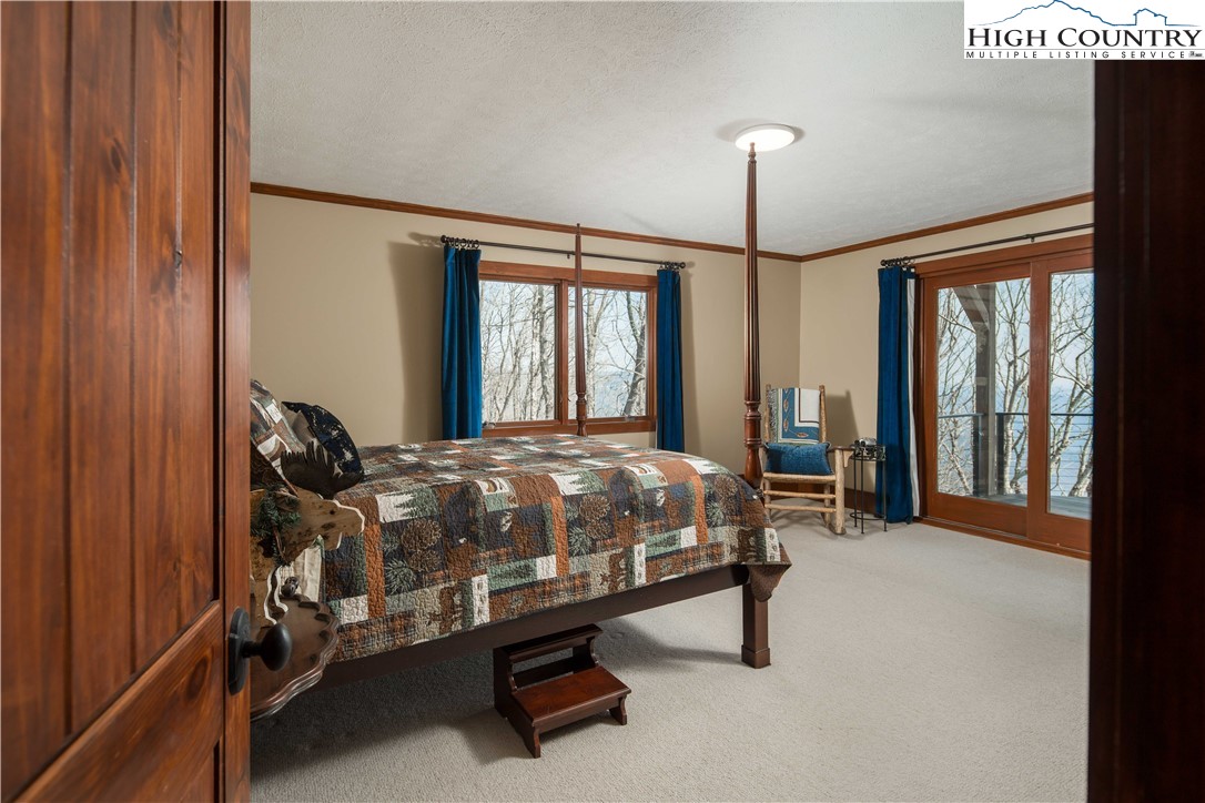 260 Beacon Hill Blowing Rock, NC 28605 - Photo 30 of 47 a bedroom with bed and window