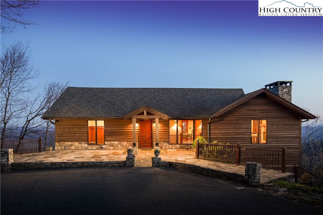 260 Beacon Hill Blowing Rock, NC 28605 - Photo 3 of 47 a front view of a house with a yard