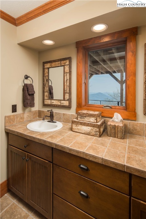 260 Beacon Hill Blowing Rock, NC 28605 - Photo 32 of 47 a bathroom with a sink and a mirror