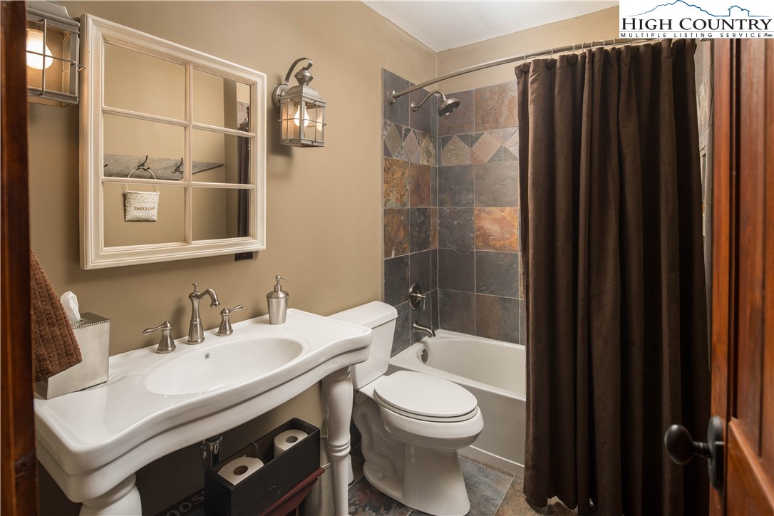 260 Beacon Hill Blowing Rock, NC 28605 - Photo 34 of 47 a bathroom with a sink a toilet and shower