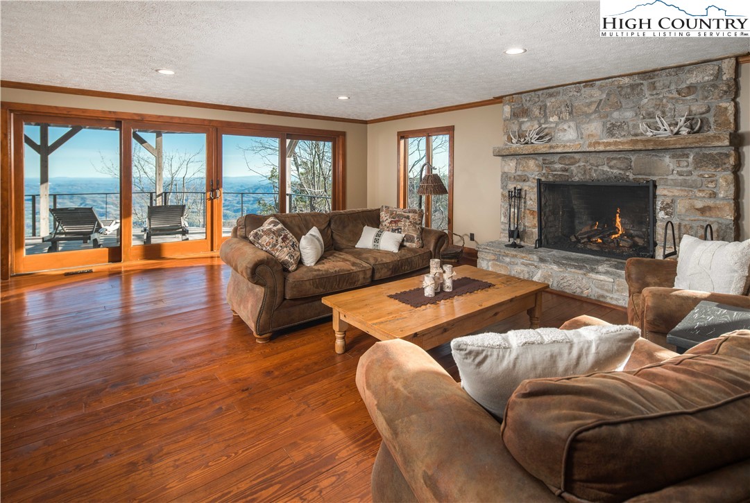 260 Beacon Hill Blowing Rock, NC 28605 - Photo 37 of 47 a living room with furniture and a fireplace