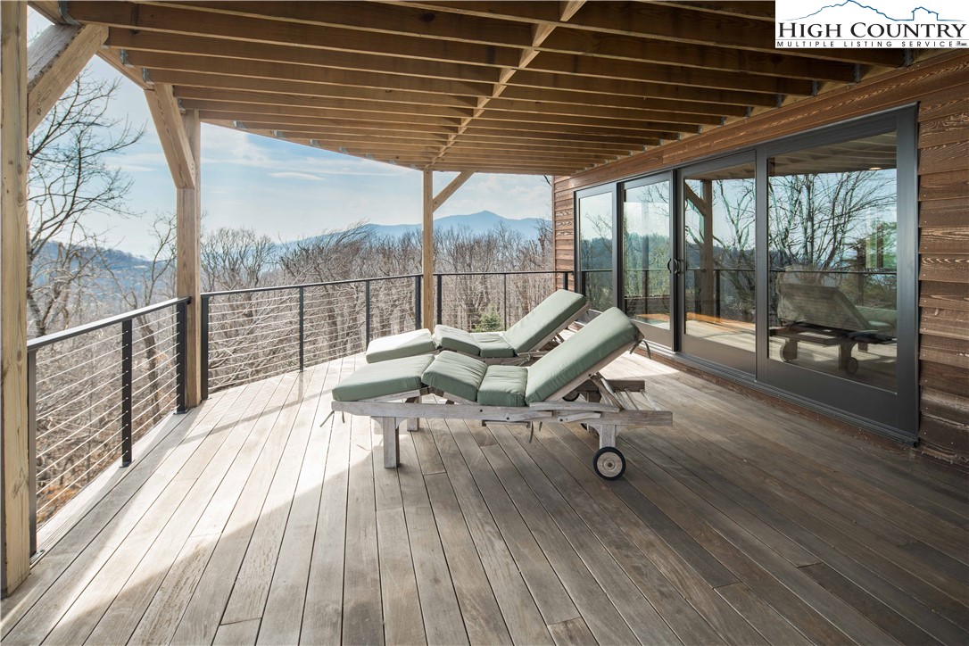 260 Beacon Hill Blowing Rock, NC 28605 - Photo 40 of 47 a view of roof deck with wooden floor and outdoor seating