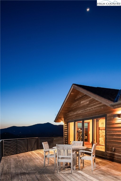 260 Beacon Hill Blowing Rock, NC 28605 - Photo 46 of 47 a view of patio with a table and chairs under an umbrella with a small yard
