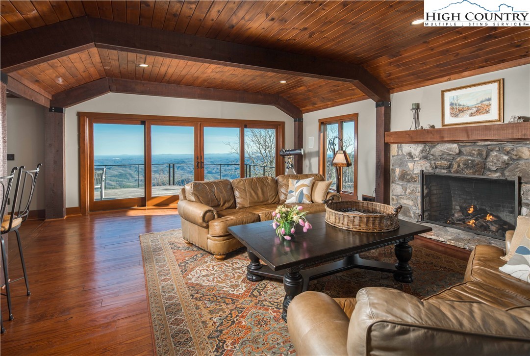 260 Beacon Hill Blowing Rock, NC 28605 - Photo 8 of 47 a living room with furniture and a fireplace