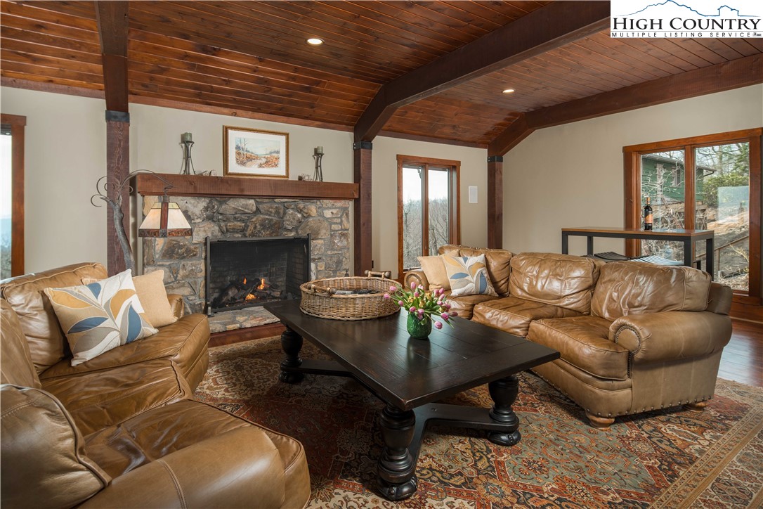 260 Beacon Hill Blowing Rock, NC 28605 - Photo 10 of 47 a living room with furniture and a fireplace