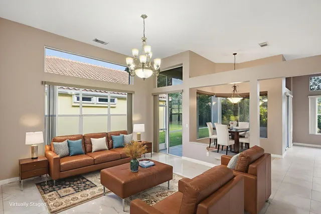 a view of a dining room with furniture wooden floor and chandelier