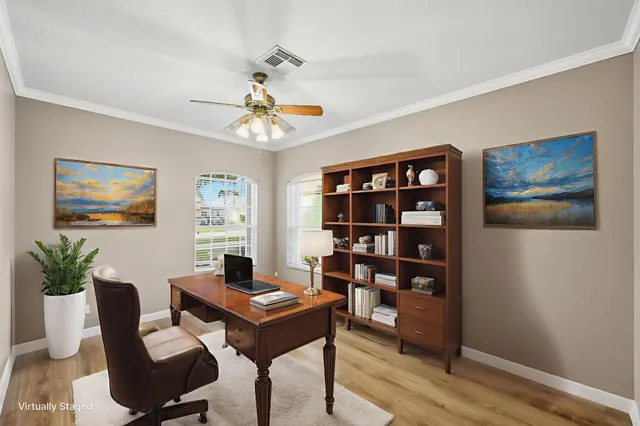 a dining room with furniture a chandelier and window